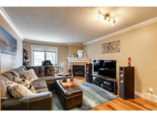 2-2427 29 Street Sw, Calgary, AB - Indoor Photo Showing Living Room With Fireplace