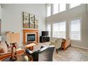 71 Copperstone Drive Se, Calgary, AB  - Indoor Photo Showing Living Room With Fireplace 