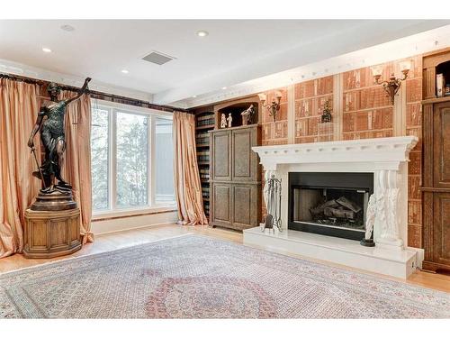 19 Pump Hill Close Sw, Calgary, AB - Indoor Photo Showing Living Room With Fireplace