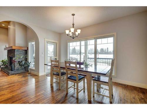 672 Royalite Way Se, Diamond Valley, AB - Indoor Photo Showing Dining Room With Fireplace