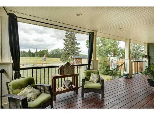 672 Royalite Way Se, Diamond Valley, AB - Outdoor With Deck Patio Veranda With Exterior