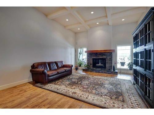 672 Royalite Way Se, Diamond Valley, AB - Indoor Photo Showing Living Room With Fireplace