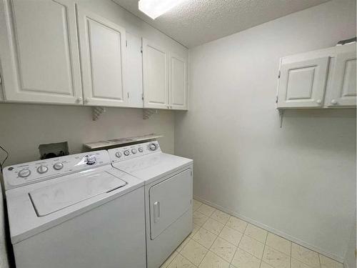 #406-4514 54 Avenue, Olds, AB - Indoor Photo Showing Laundry Room