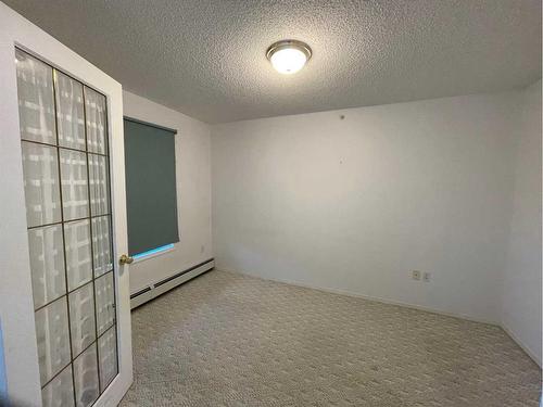 #406-4514 54 Avenue, Olds, AB - Indoor Photo Showing Other Room