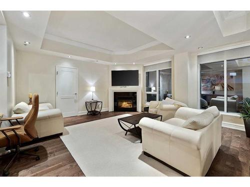 305-600 Princeton Way Sw, Calgary, AB - Indoor Photo Showing Living Room With Fireplace