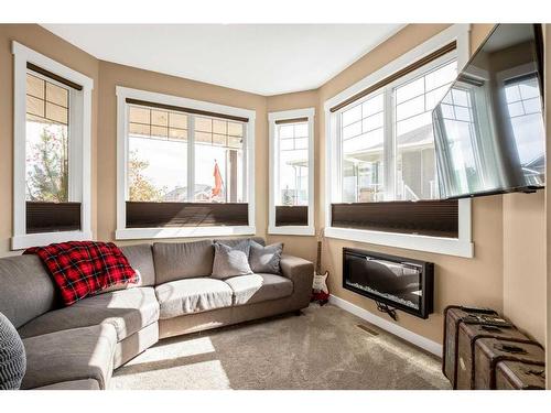 71 Sheep River Heights, Okotoks, AB - Indoor Photo Showing Living Room With Fireplace