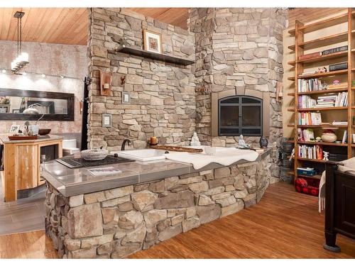 370120 176 Street West, Rural Foothills County, AB - Indoor Photo Showing Dining Room With Fireplace