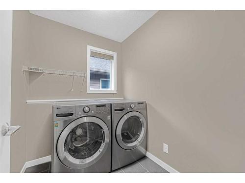 79 Evansfield Road Nw, Calgary, AB - Indoor Photo Showing Laundry Room