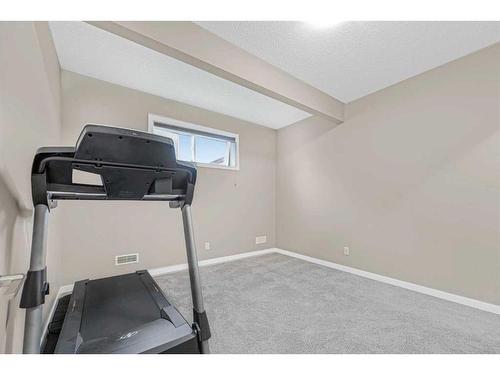 79 Evansfield Road Nw, Calgary, AB - Indoor Photo Showing Gym Room