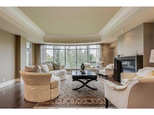 308-600 Princeton Way Sw, Calgary, AB - Indoor Photo Showing Living Room With Fireplace