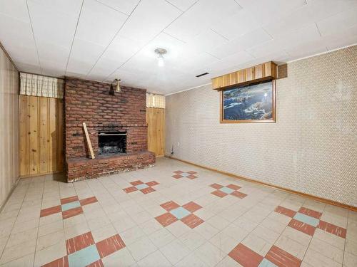 7504 Elbow Drive Sw, Calgary, AB - Indoor Photo Showing Other Room With Fireplace