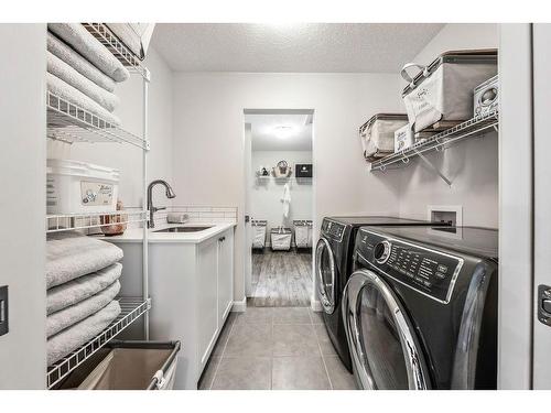 150 Riviera View, Cochrane, AB - Indoor Photo Showing Laundry Room