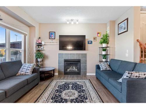 267 Martin Crossing Place Ne, Calgary, AB - Indoor Photo Showing Living Room With Fireplace