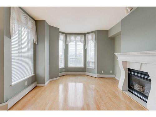 509-1718 14 Avenue Nw, Calgary, AB - Indoor With Fireplace