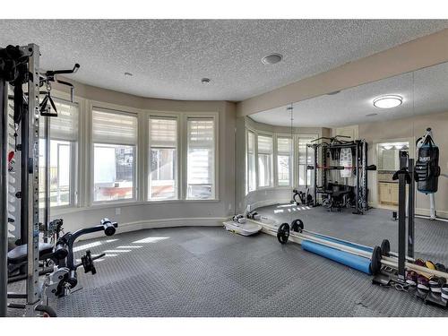 41 Cougar Plateau Point Sw, Calgary, AB - Indoor Photo Showing Gym Room