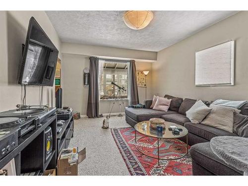 A/B-332 Beaver Street, Banff, AB - Indoor Photo Showing Living Room