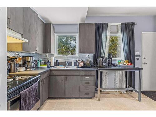 A/B-332 Beaver Street, Banff, AB - Indoor Photo Showing Kitchen With Double Sink