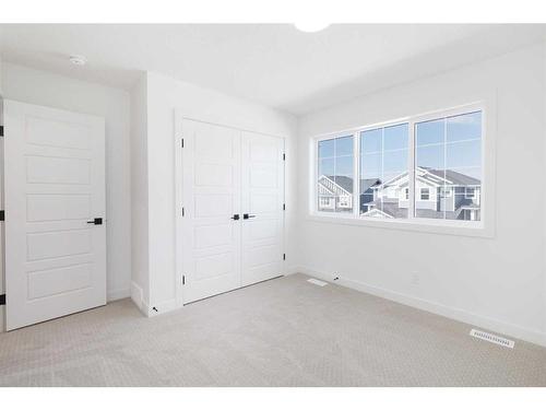 60 Sunvalley View, Cochrane, AB - Indoor Photo Showing Other Room