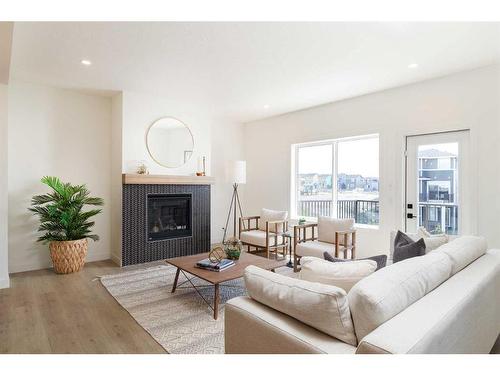 60 Sunvalley View, Cochrane, AB - Indoor Photo Showing Living Room With Fireplace