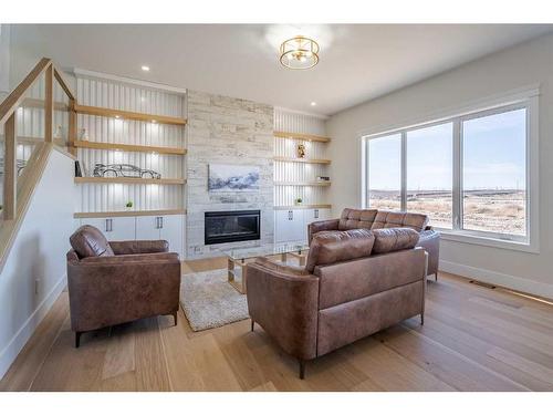 104 Waterstone Park, Chestermere, AB - Indoor Photo Showing Living Room With Fireplace
