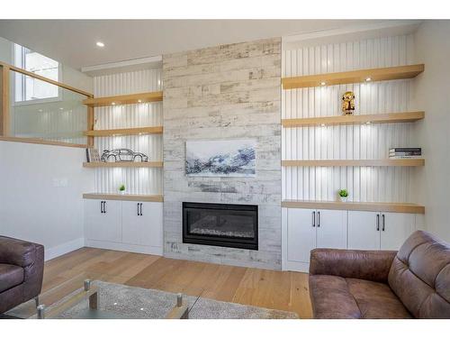 104 Waterstone Park, Chestermere, AB - Indoor Photo Showing Living Room With Fireplace