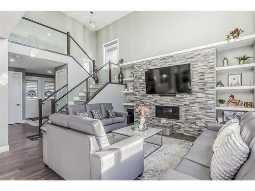 116 Sandpiper Landing, Chestermere, AB - Indoor Photo Showing Living Room With Fireplace
