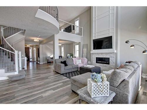 179 Masters Cove Se, Calgary, AB - Indoor Photo Showing Living Room With Fireplace
