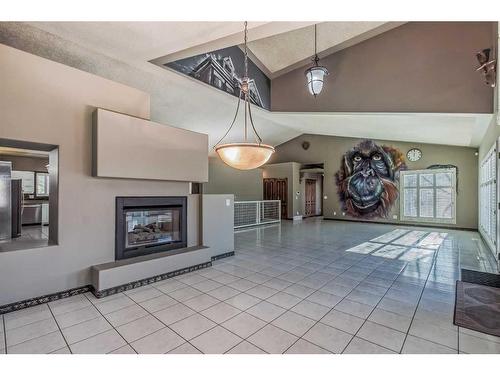 672 East Chestermere Drive, Chestermere, AB - Indoor Photo Showing Other Room With Fireplace