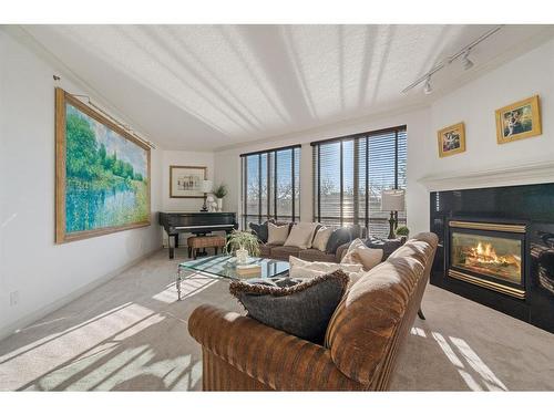 402-228 26 Avenue Sw, Calgary, AB - Indoor Photo Showing Living Room With Fireplace