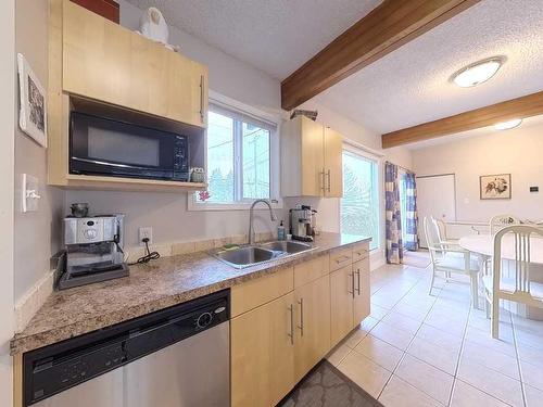 811 Millar Road Ne, Calgary, AB - Indoor Photo Showing Kitchen With Double Sink