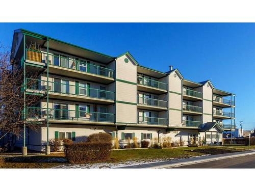 302-5100 52 Street, Olds, AB - Outdoor With Balcony With Facade