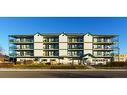 302-5100 52 Street, Olds, AB  - Outdoor With Balcony With Facade 