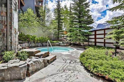 223 Rot A-1818 Mountain Avenue, Canmore, AB - Outdoor With In Ground Pool