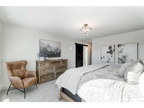 116 Sunrise Heath, Cochrane, AB - Indoor Photo Showing Bedroom