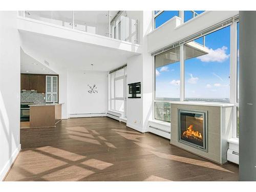2102-99 Spruce Place Sw, Calgary, AB - Indoor With Fireplace