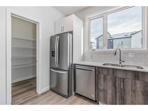 254-301 Redstone Boulevard Ne, Calgary, AB - Indoor Photo Showing Kitchen With Double Sink