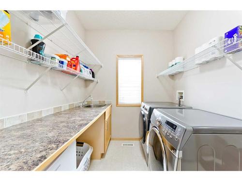 140 West Creek Glen, Chestermere, AB - Indoor Photo Showing Laundry Room