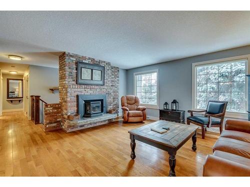 5128 Baines Road Nw, Calgary, AB - Indoor Photo Showing Living Room With Fireplace