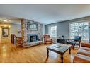 5128 Baines Road Nw, Calgary, AB  - Indoor Photo Showing Living Room With Fireplace 