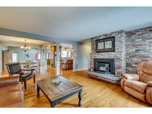 5128 Baines Road Nw, Calgary, AB - Indoor Photo Showing Living Room With Fireplace