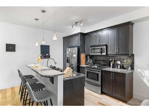 102-41 6A Street Ne, Calgary, AB - Indoor Photo Showing Kitchen With Stainless Steel Kitchen With Upgraded Kitchen
