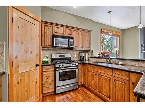 410-107 Armstrong Place, Canmore, AB - Indoor Photo Showing Kitchen With Double Sink