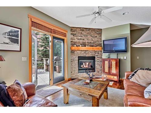 410-107 Armstrong Place, Canmore, AB - Indoor Photo Showing Living Room With Fireplace