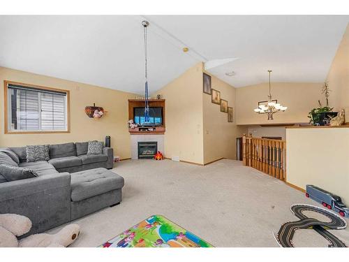 622 Saddlecreek Way Ne, Calgary, AB - Indoor Photo Showing Living Room With Fireplace