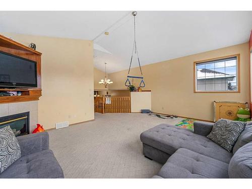 622 Saddlecreek Way Ne, Calgary, AB - Indoor Photo Showing Living Room With Fireplace
