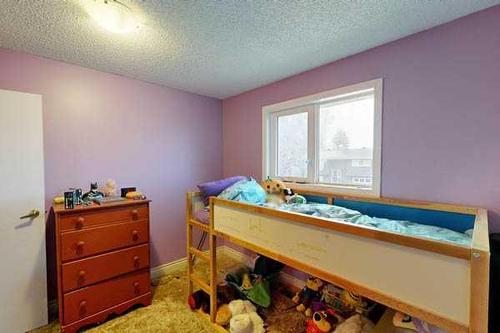 313 54 Avenue East, Claresholm, AB - Indoor Photo Showing Bedroom