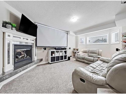 1510 10 Avenue Se, High River, AB - Indoor Photo Showing Living Room With Fireplace