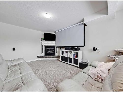 1510 10 Avenue Se, High River, AB - Indoor With Fireplace