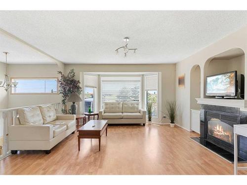 5335 84 Street Ne, Calgary, AB - Indoor Photo Showing Living Room With Fireplace