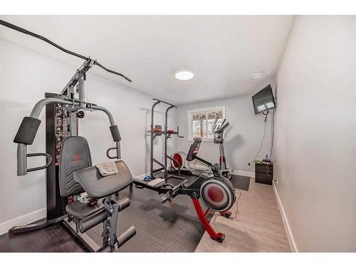 34 Windcreek Terrace Sw, Airdrie, AB - Indoor Photo Showing Gym Room